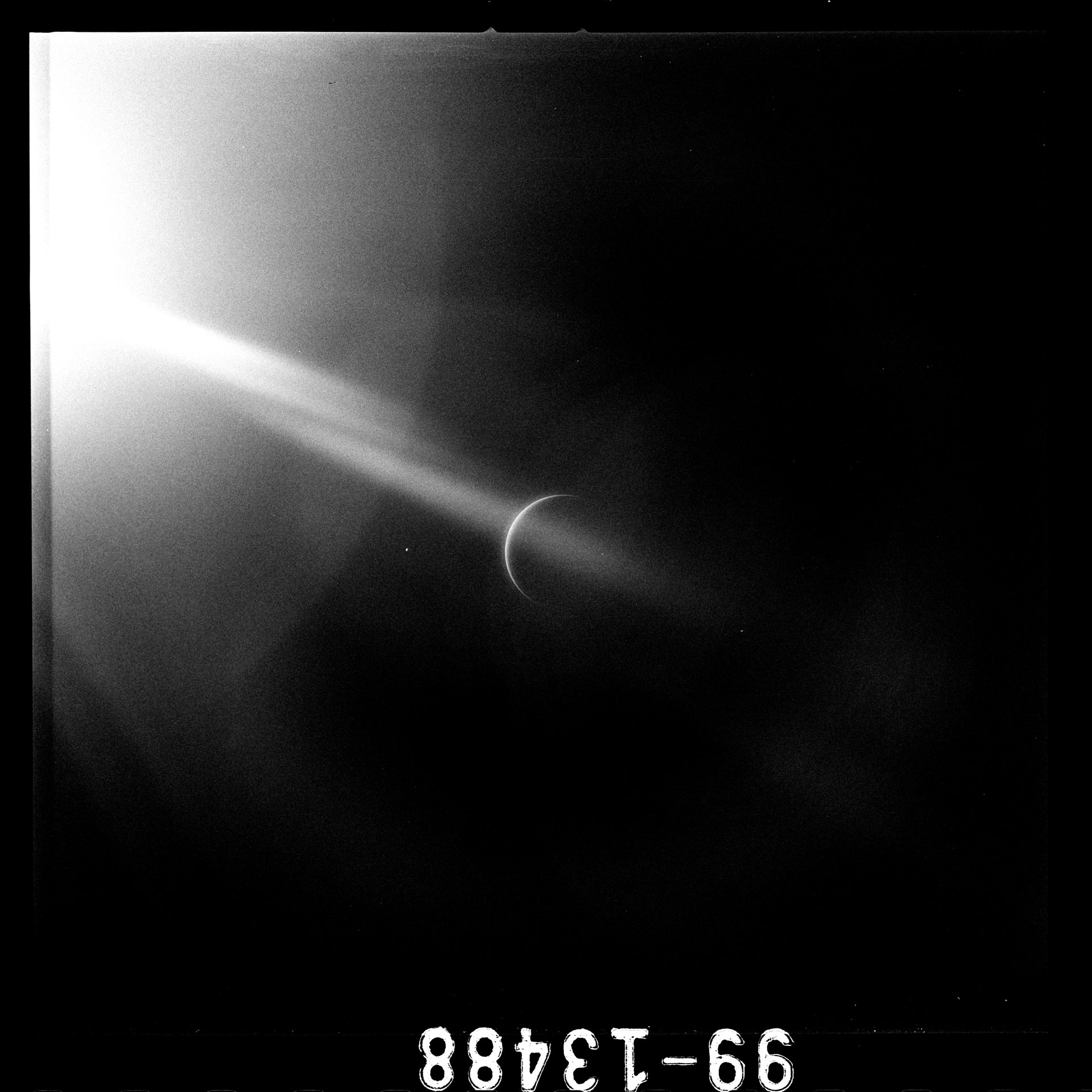 UV photograph (AS15-99-13488) shot by Apollo 15 Astronaut Al Worden of a crescent Earth seen during the return home from the Moon - Apollo 15 Mission, August 4th, 1971
